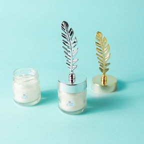 Candle with feather cover